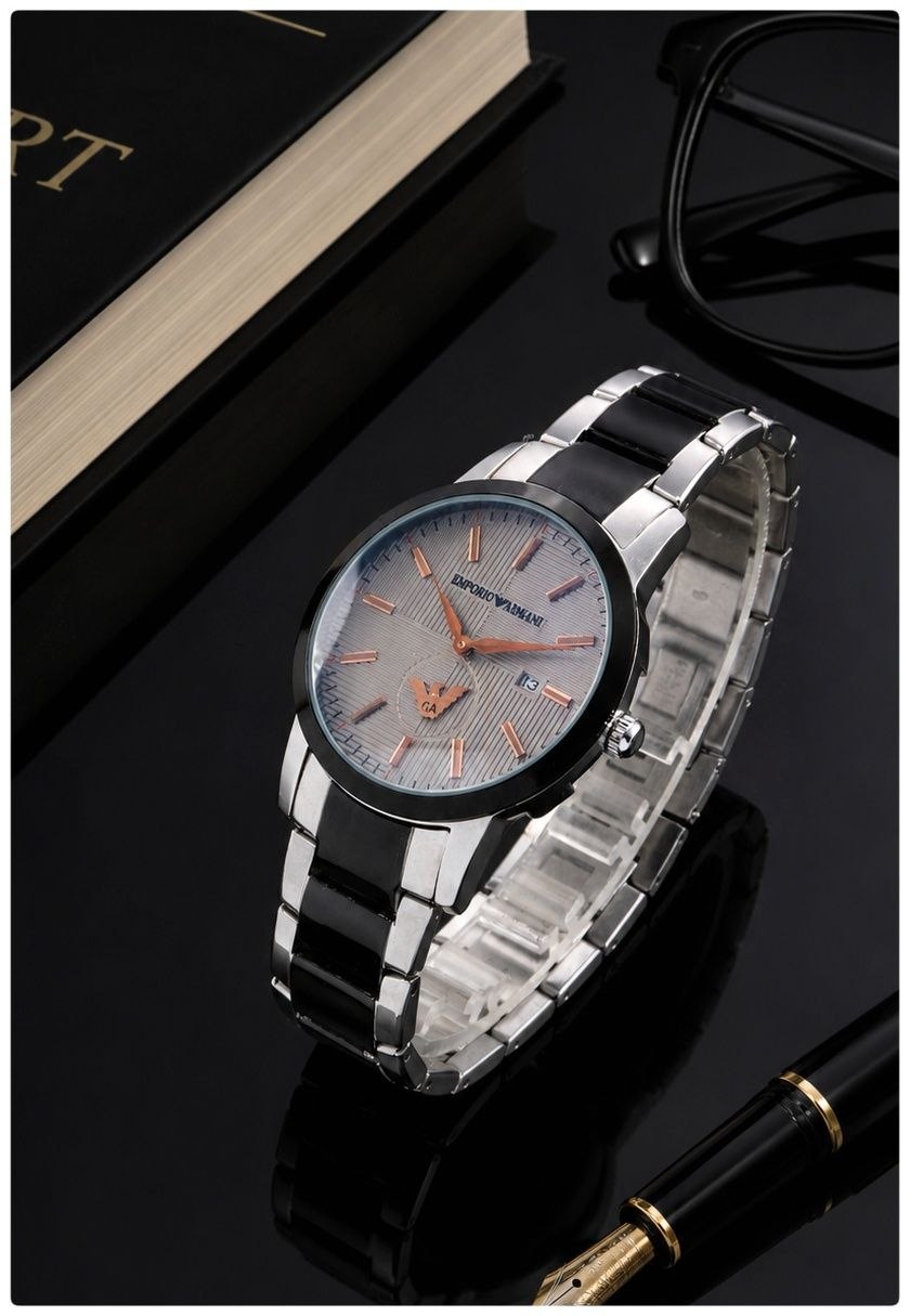 ساعت مچی مردانه Emporio Armani  ساعت بند استیل از برند  "امپریو/آرمانی"  برای آقایان   موتور ژاپن A++ دو موتور فعال (زیرثانیه) دارای روزشمار بند استیل توپر (سنگین) شیشه کریستال قفل استیل کلیپسی ضدآب در حد دست‌شستن